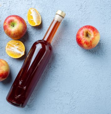 top view apple vinegar in bottle on white background juice fruit color photo fresh drink sour food